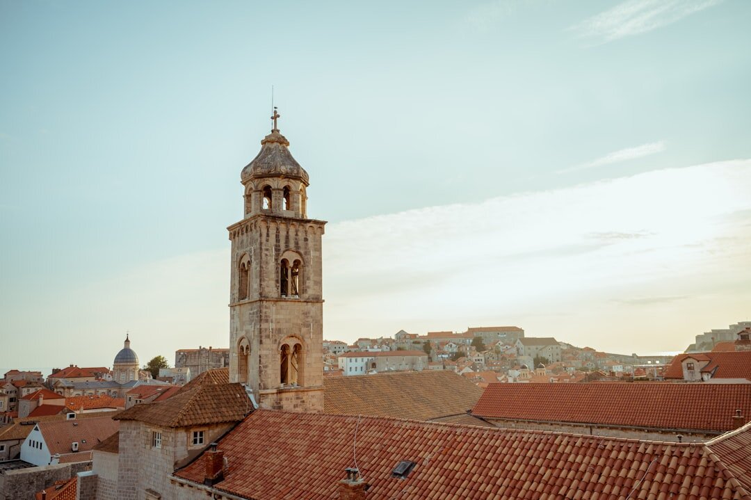 Aerial view of Dubrovnik old town rooftops and city walls at golden hour