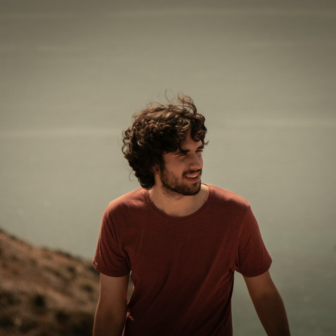 Portrait of a Croatian photographer holding a camera outdoors
