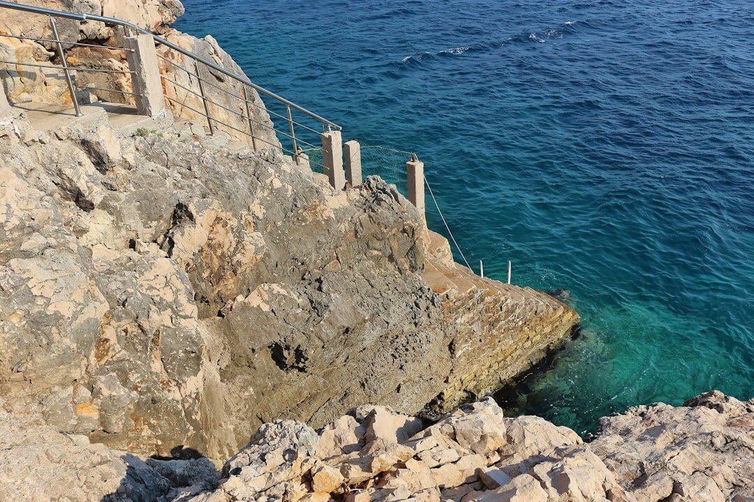 Coastal road winding along Adriatic cliffs