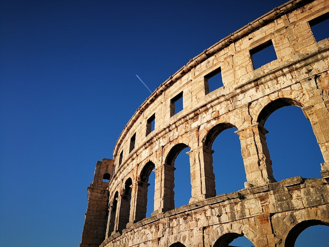 Stone arches detail of the Roman Arena in Pula