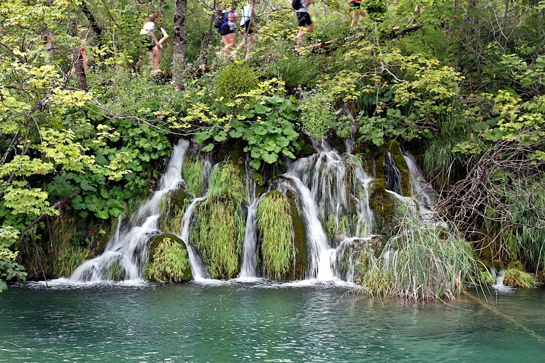 Waterfall and turquoise lake at Plitvice Lakes National Park