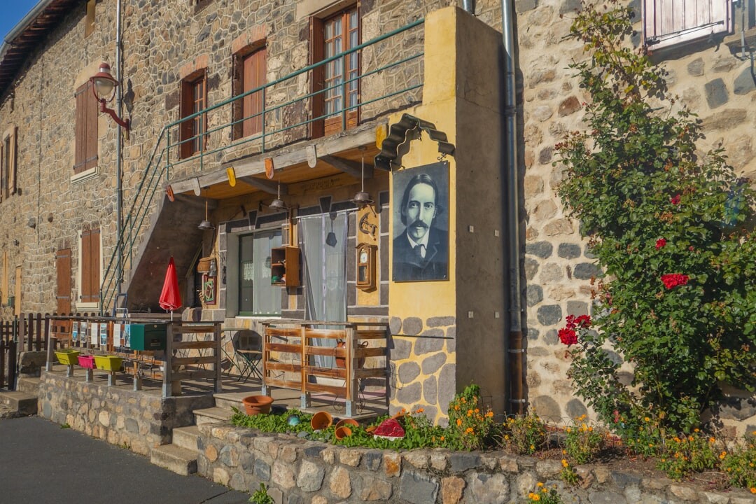Detail of a stone facade and wooden shutters