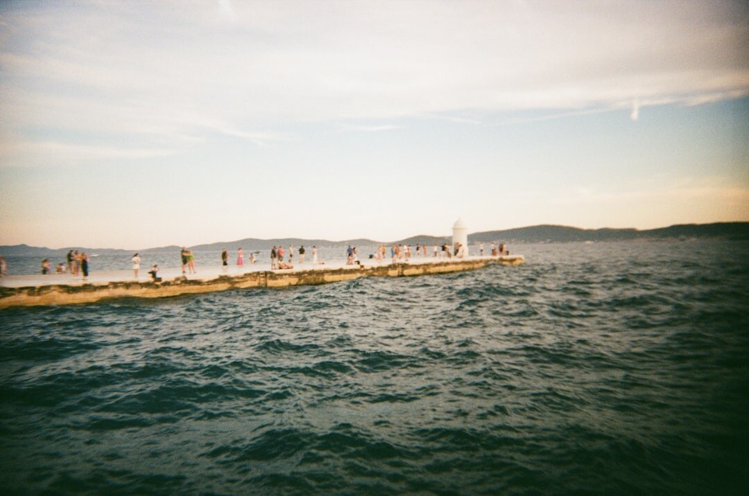 Fisherman mending nets at the Zadar harbor
