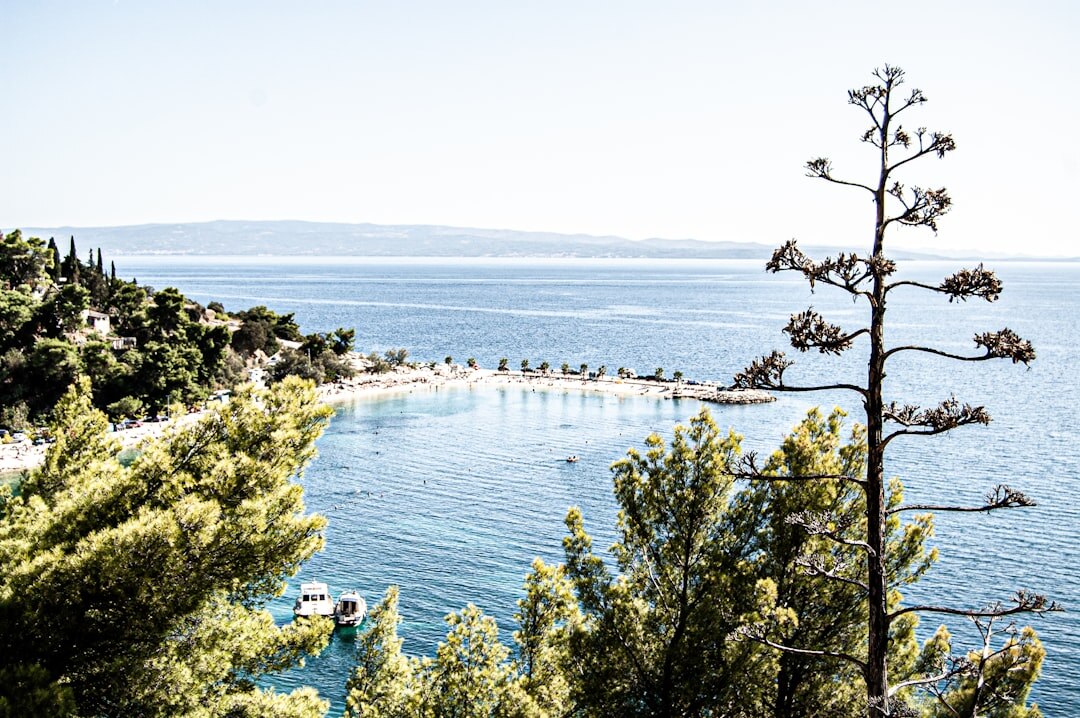 View of the Adriatic sea through a stone archway in Split