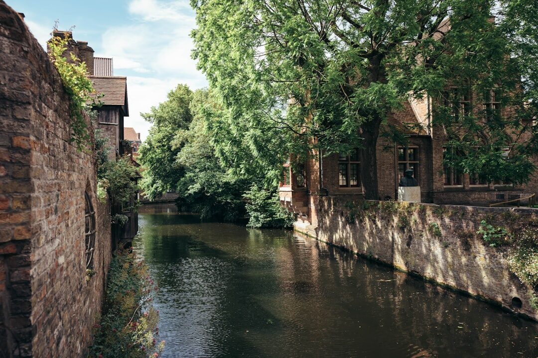 Abandoned stone mill beside a quiet river