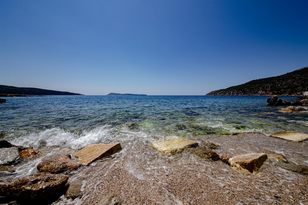 Secluded pebble beach on the island of Vis with clear water